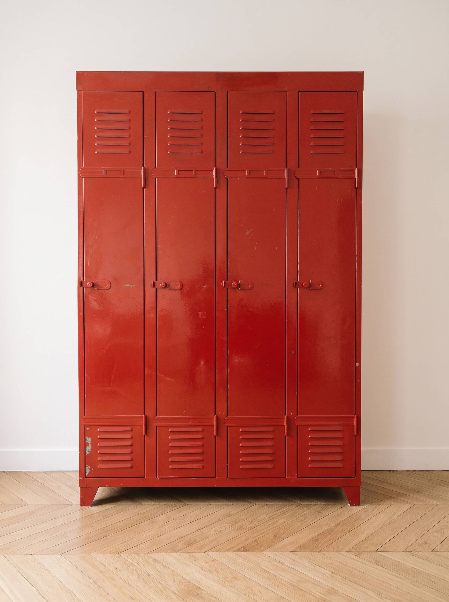 Vintage industrial wardrobe with 4 metal doors in red.