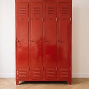 Vintage industrial wardrobe with 4 metal doors in red.