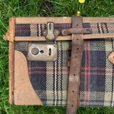 Old large suitcase in leather and tartan fabric