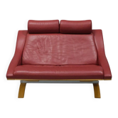 Two-seater red leather sofa by Roche Bobois on a bent beech base, France.