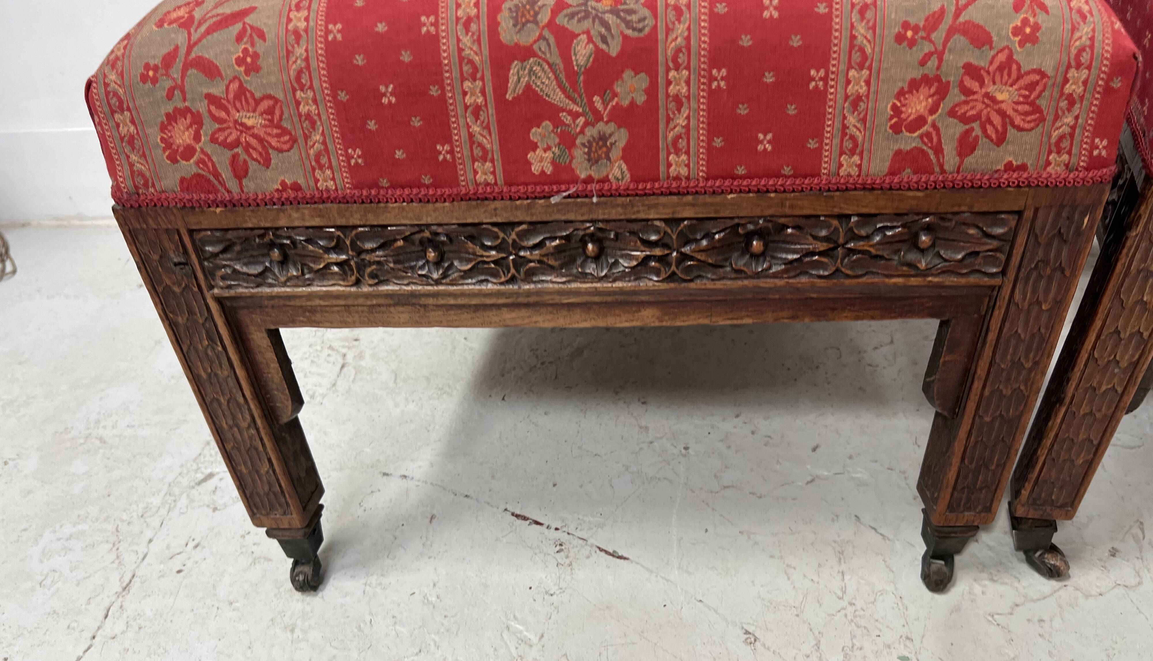 Pair of Gothic-style walnut lounge chairs, 19th century
