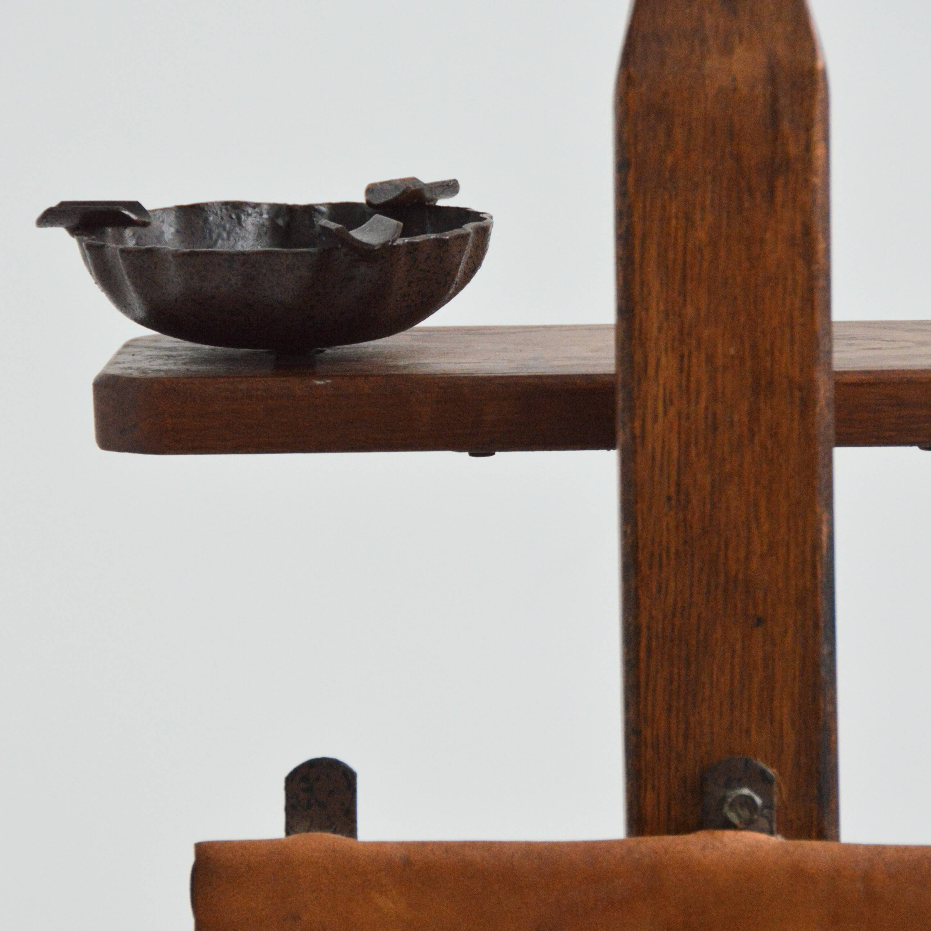 Vintage leather magazine rack with shelf and brutalist/rustic ashtray.
