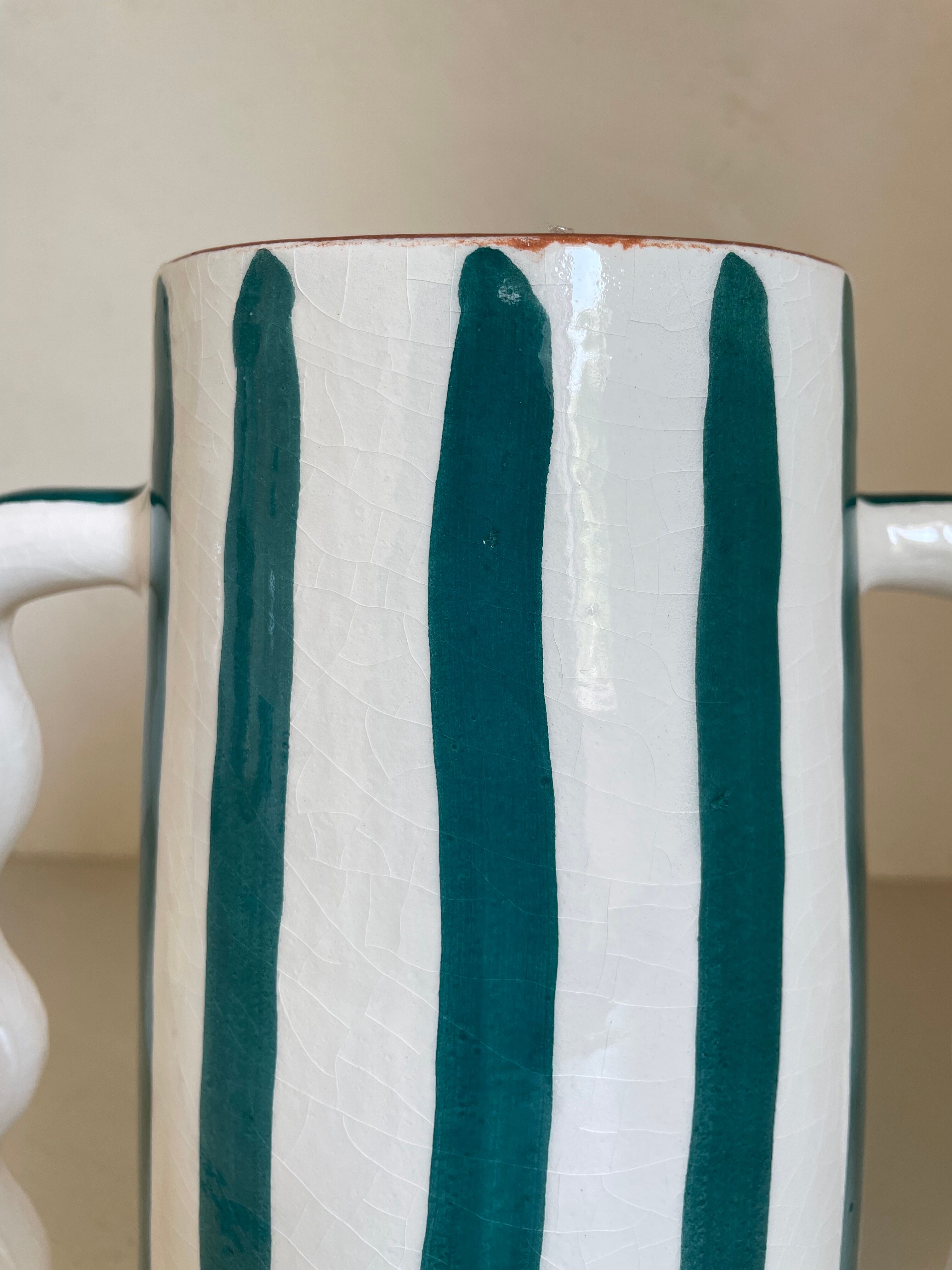 Fir and white green striped ceramic vase with handmade abstract wavy handles