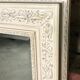 Louis XV-style mirror in wood and white stucctuc and patinated beige