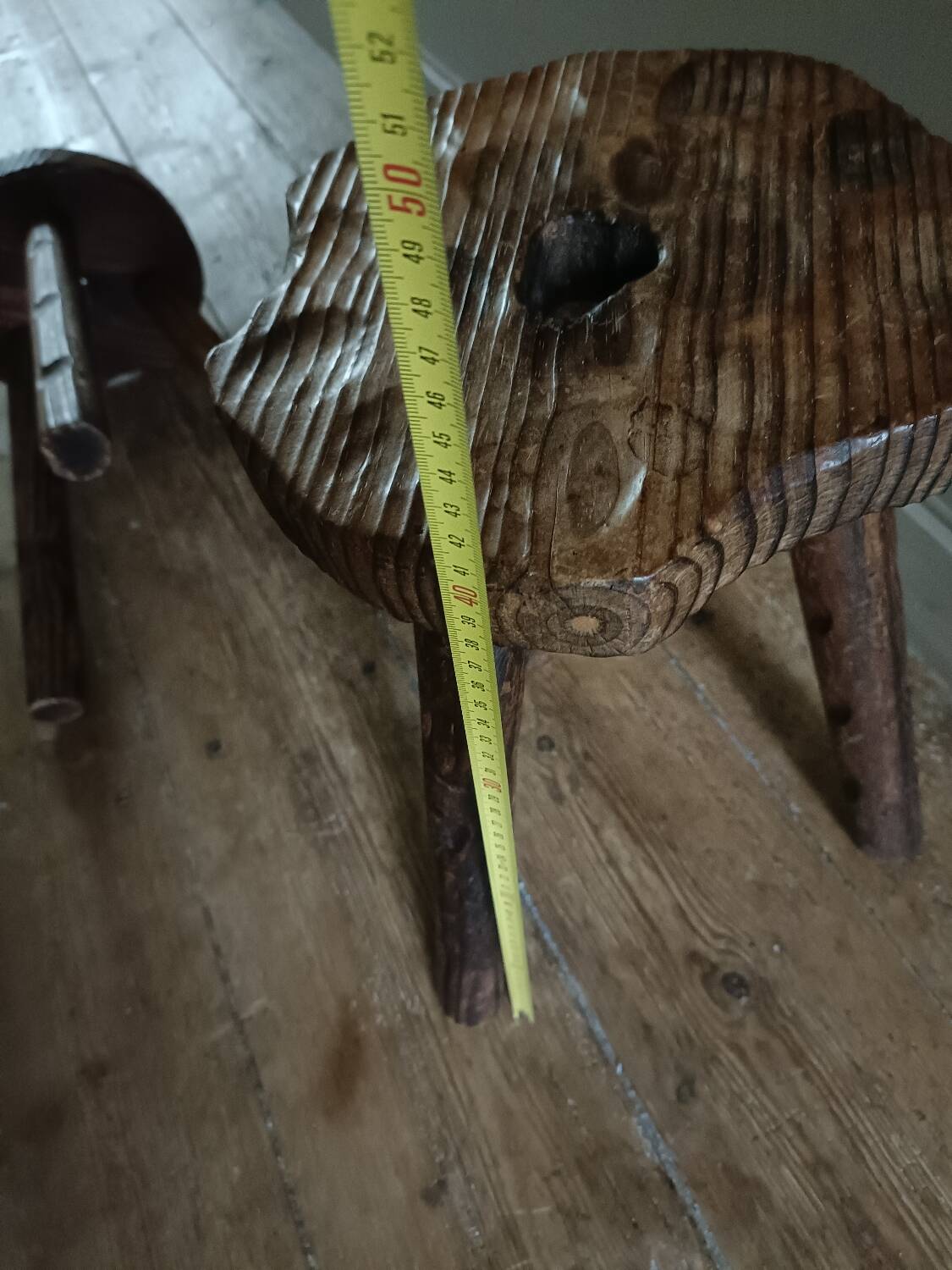 A pair of tripod stools