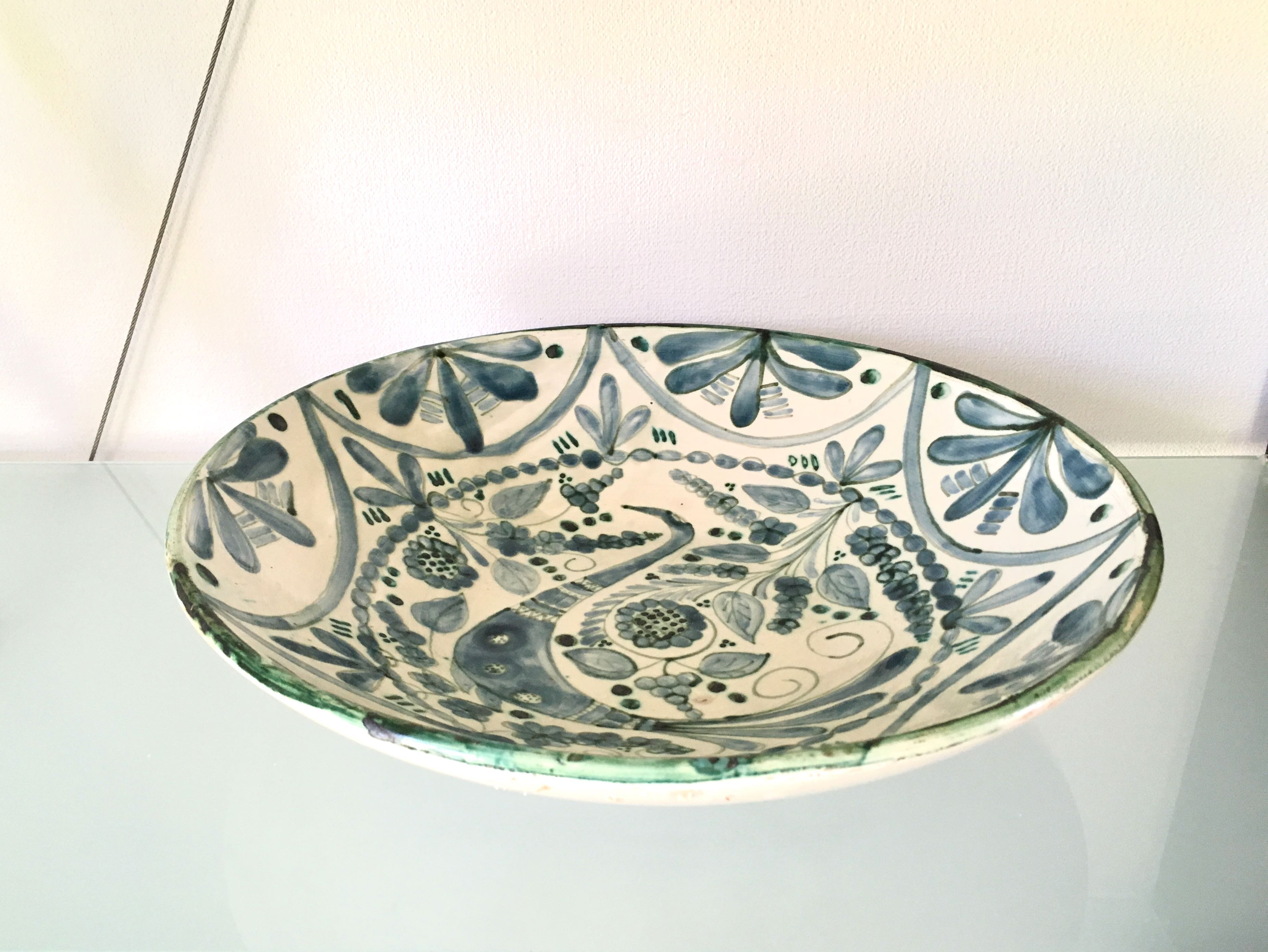 Large ceramic fruit cup with blue peacock