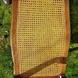 Former seat, wood and caning.