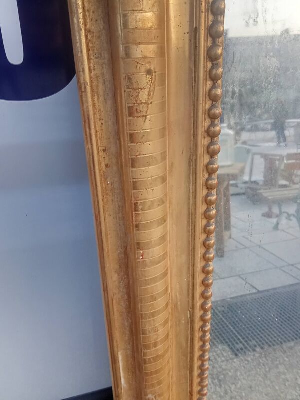 Miroir ancien Louis Philippe doré à la feuille d or.