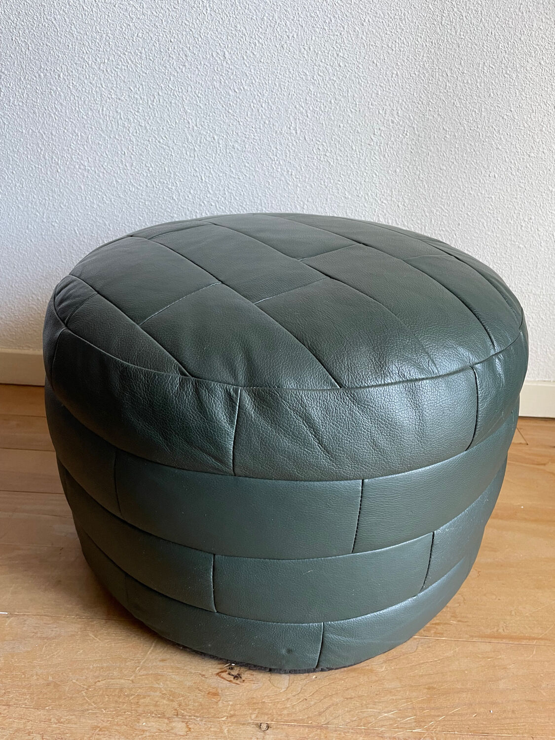 Green patchwork leather pouf from Sède