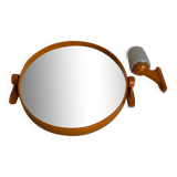 Tilting orange plastic mirror with its matching wall light