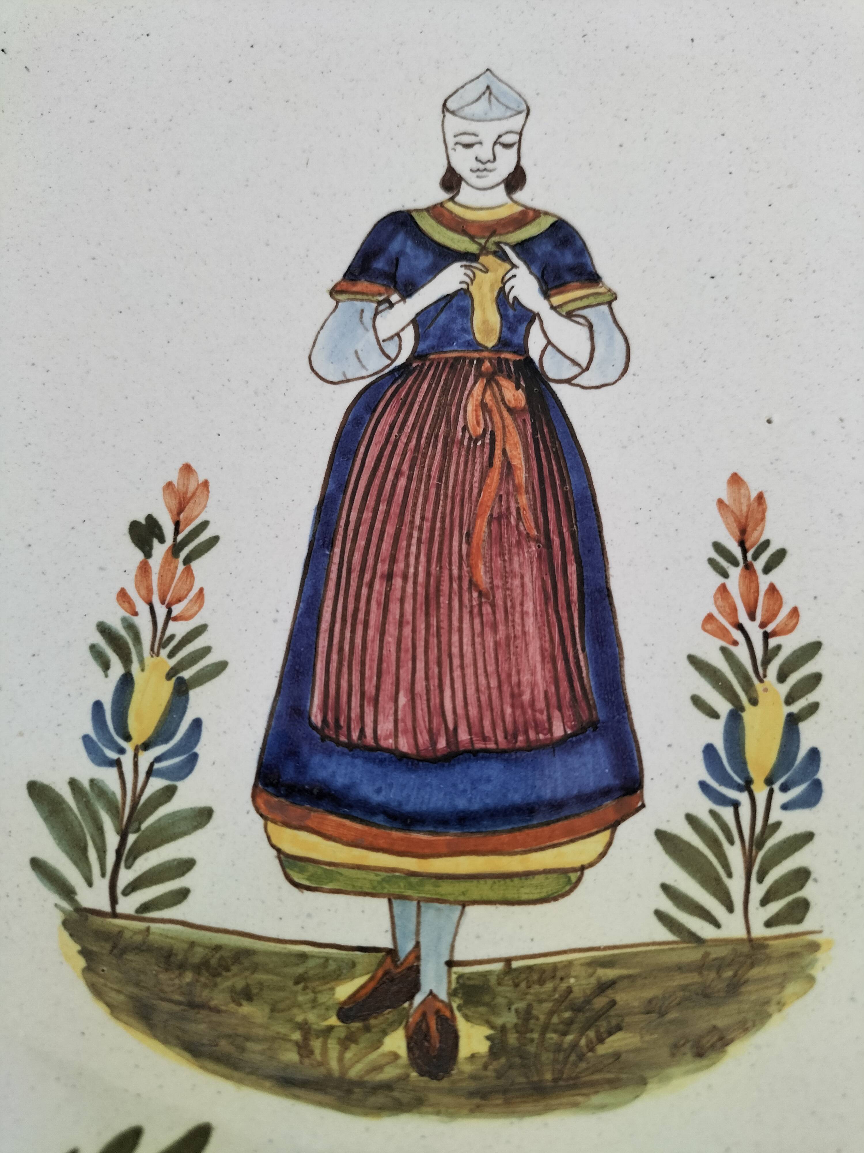 Hand-painted Breton plate, decorated with a woman knitting, 1950s