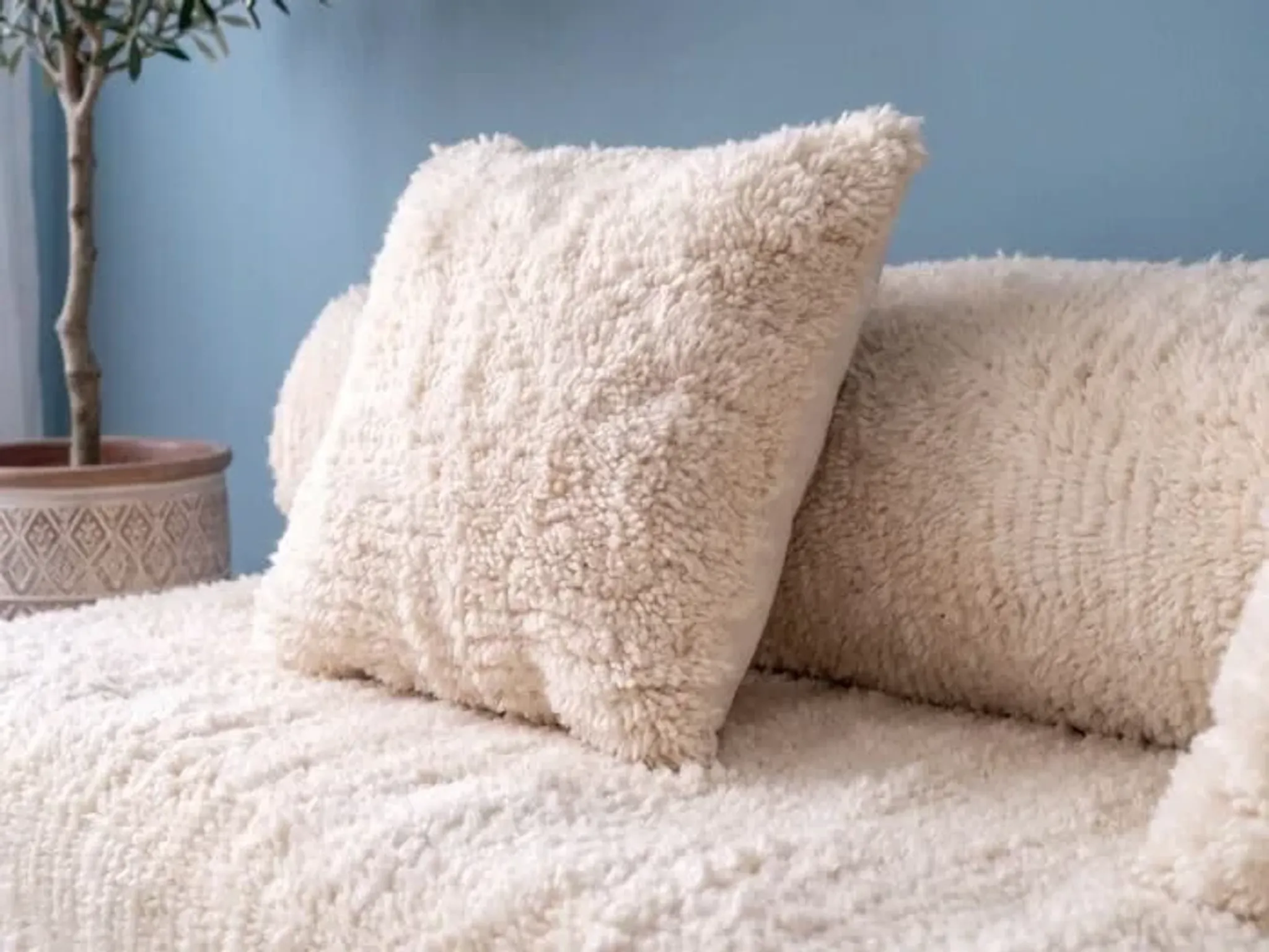 White Moroccan Arabic sofa with a rounded backrest.