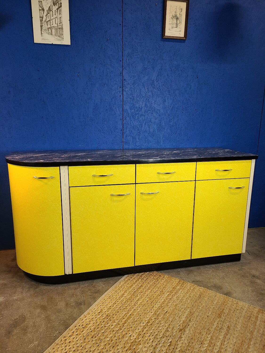 Vintage yellow sideboard, and black marble top.