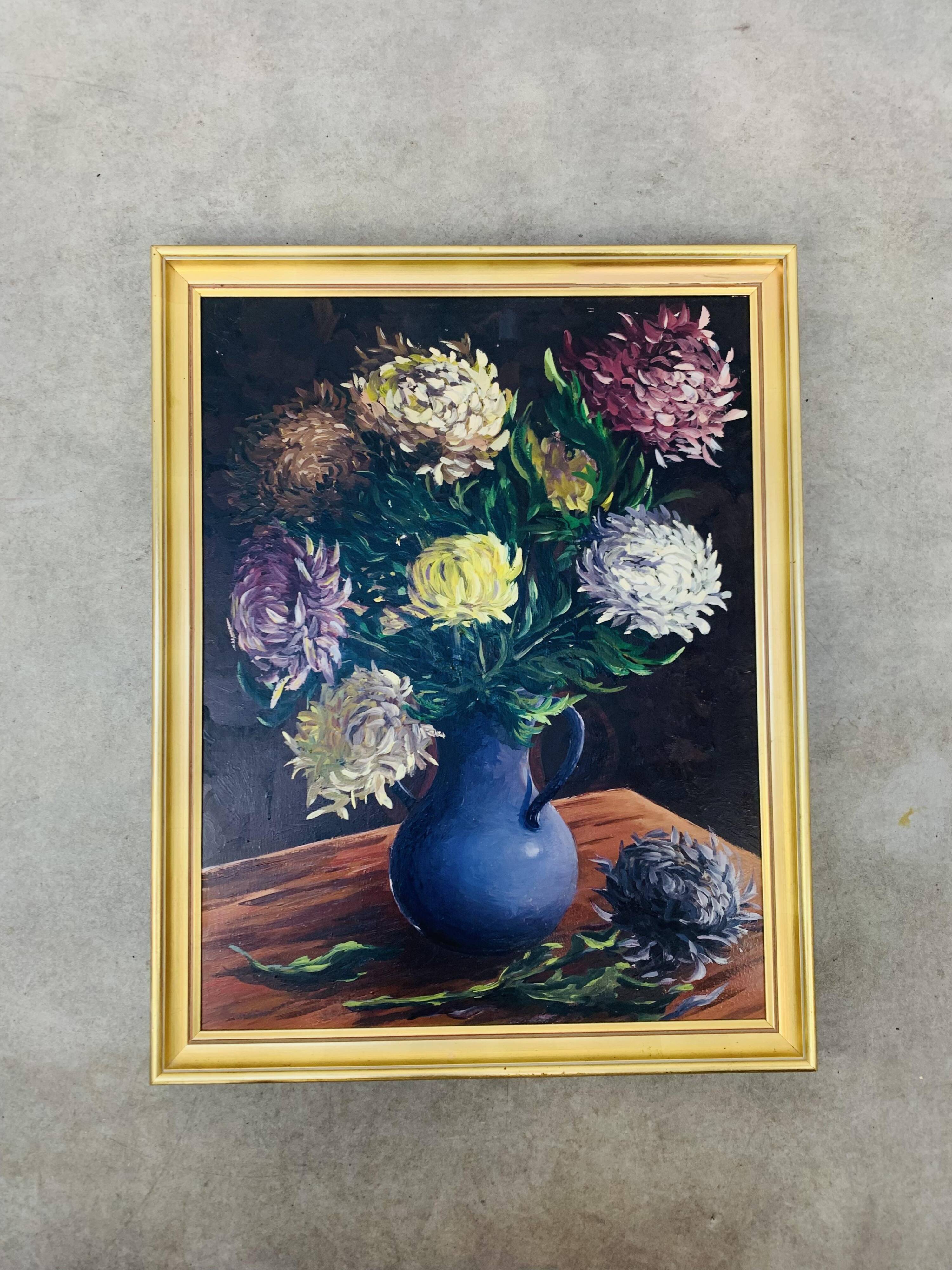 Still life painting of a bouquet of flowers, golden frame