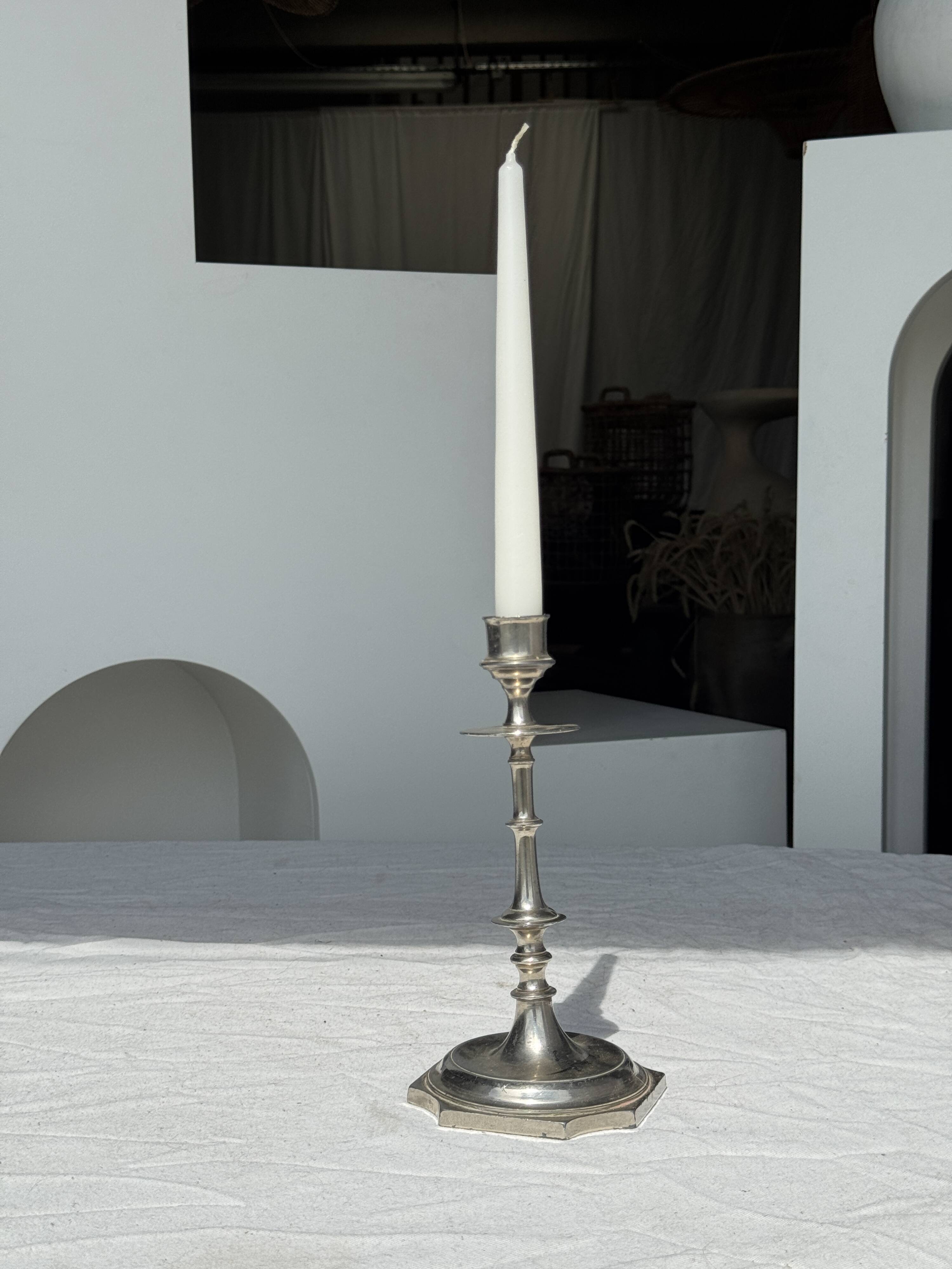 A large silver candlestick holder H23