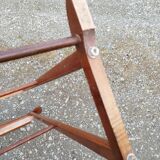 Valet wearing double wood coat rack