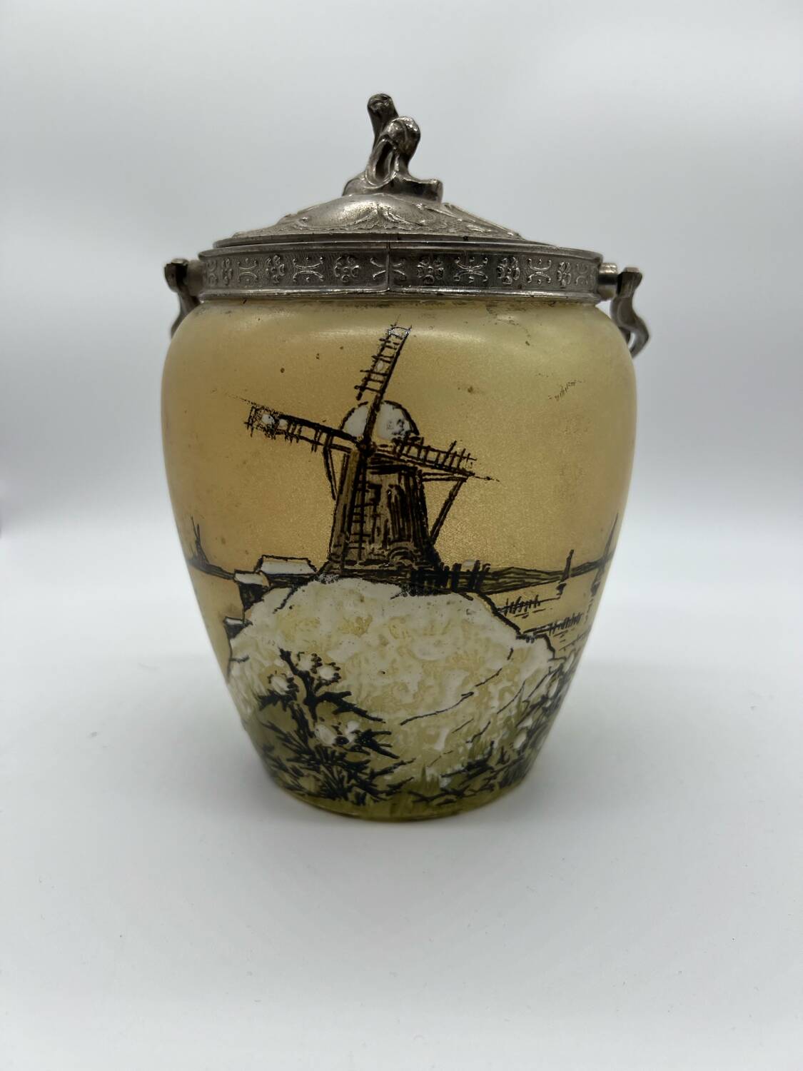 Old enameled glass cookie jar with mill decor