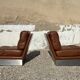 2 armchairs and 1 ottoman in brushed aluminium and brown leather, France, 1970.