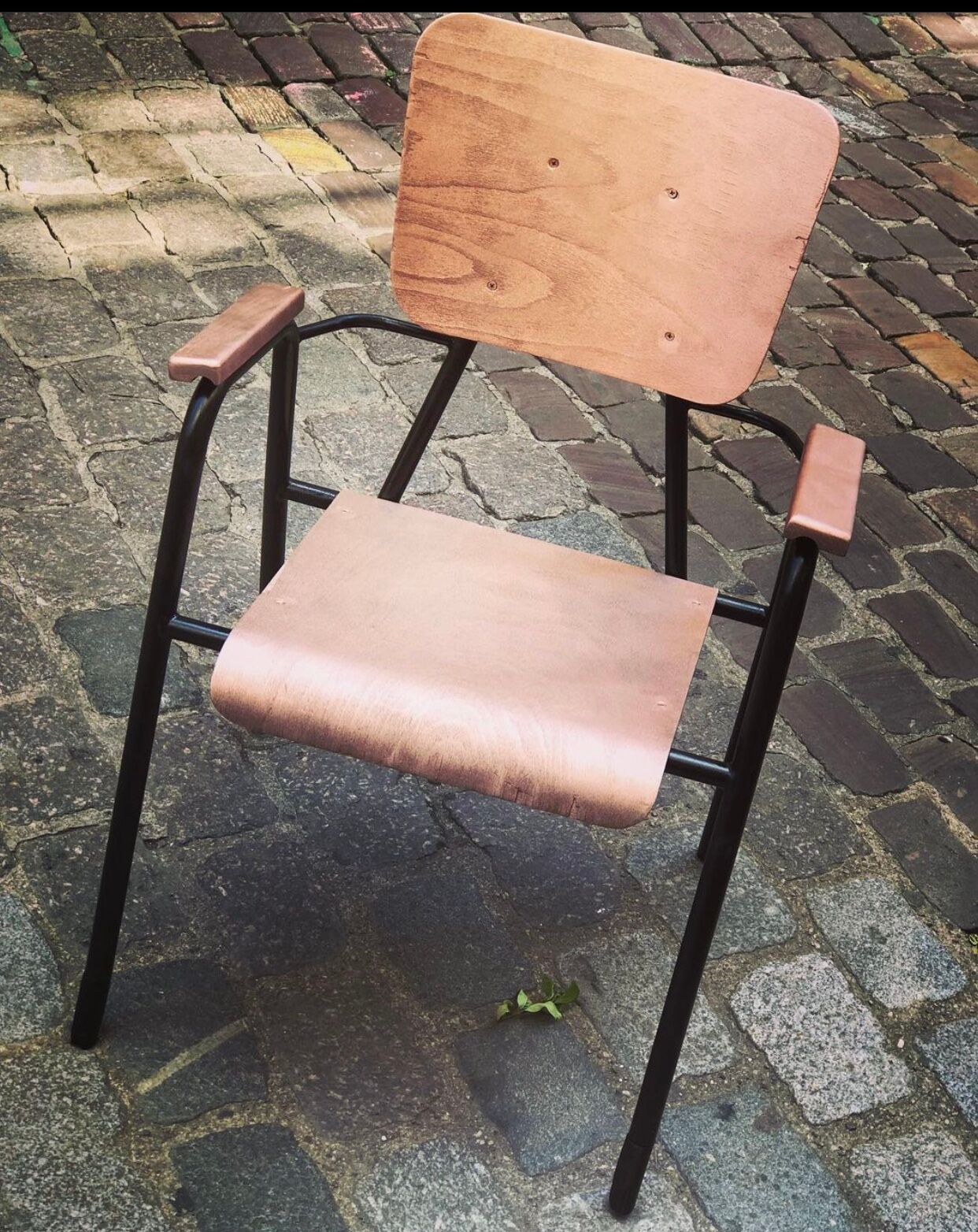 Old chair with armrest restored in metallic pink