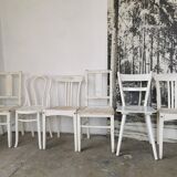 Set of 6 mismatched white chairs
