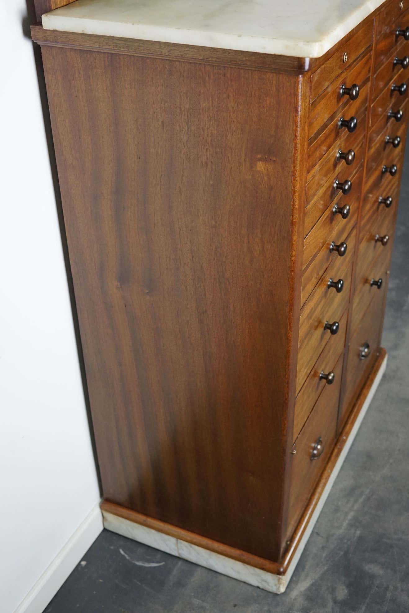 Antique dental practice in mahogany and marble Amsterdam around 1920