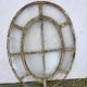 Bull's-eye window from the 19th century in iron (with opening).