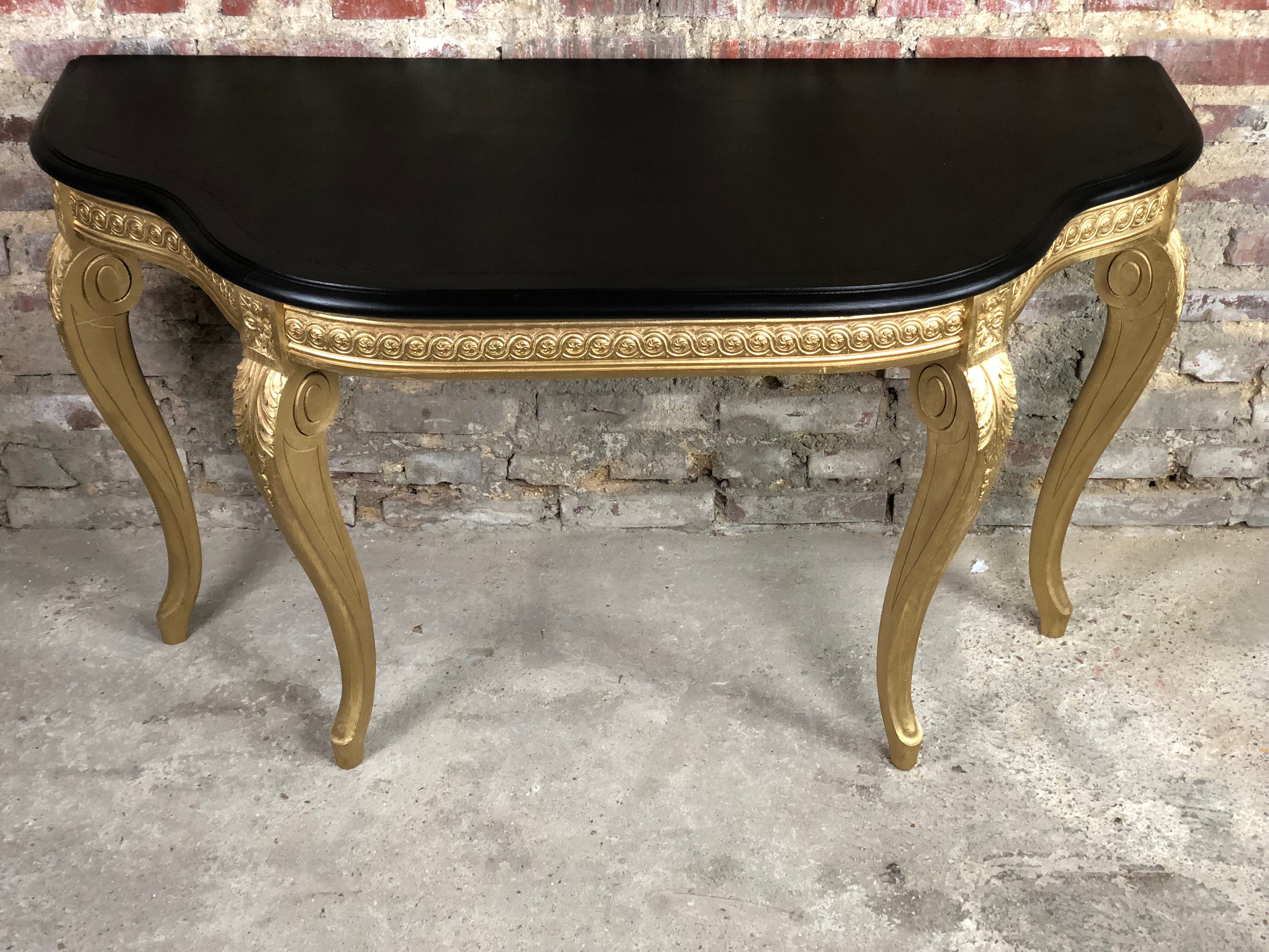 Louis XV style console in carved wood with waxed black wood top
