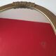 Miroir vintage art deco en platre doré avec detail fleurs,  quelques endroits rebords arriere abimé