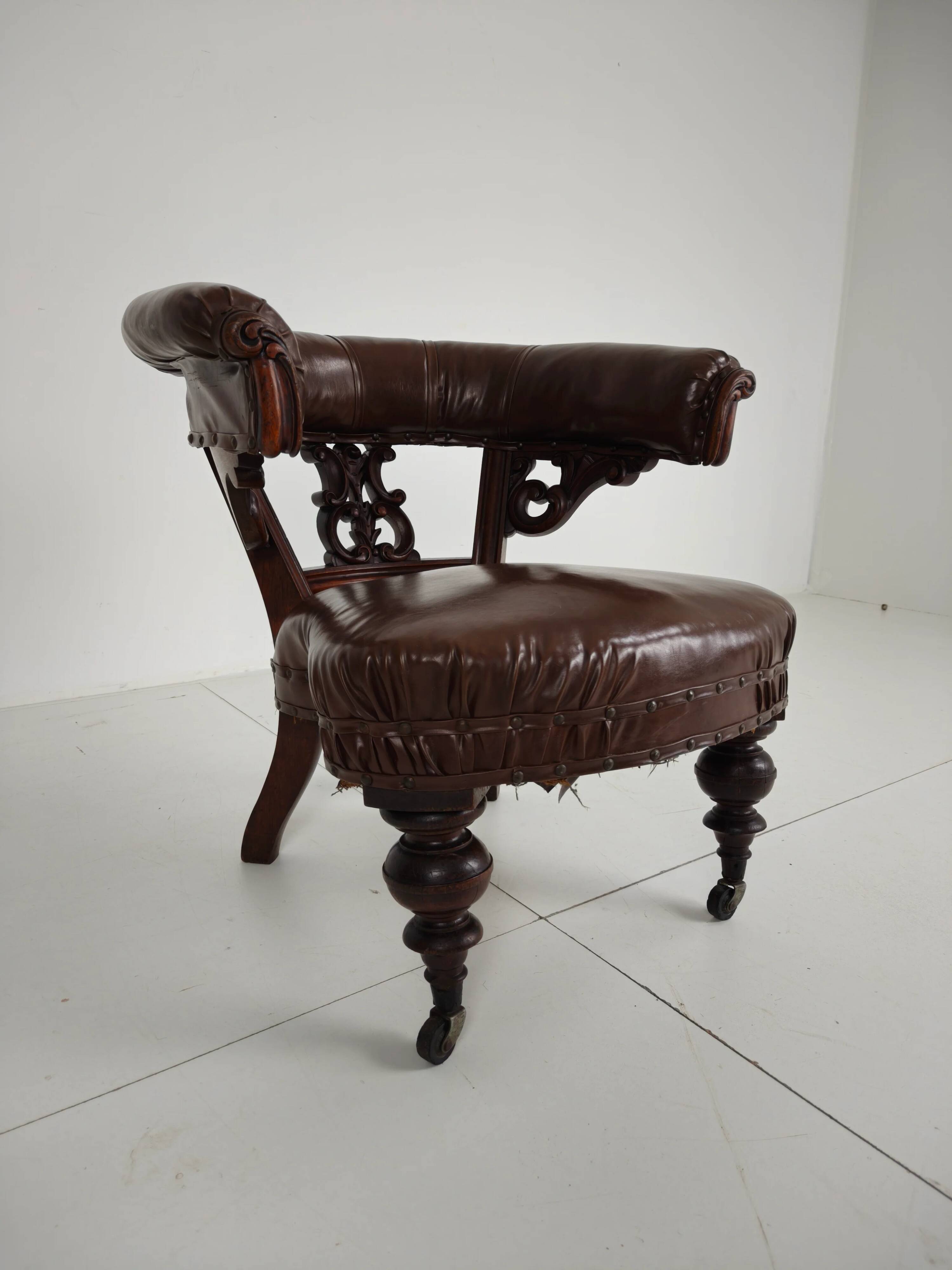 Antique leather armchair by Robson & Son – carved wood & castors, Newcastle
