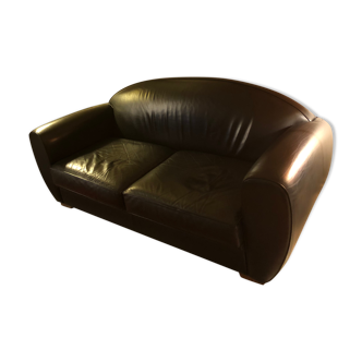 Black leather sofa by Huges Chevalier