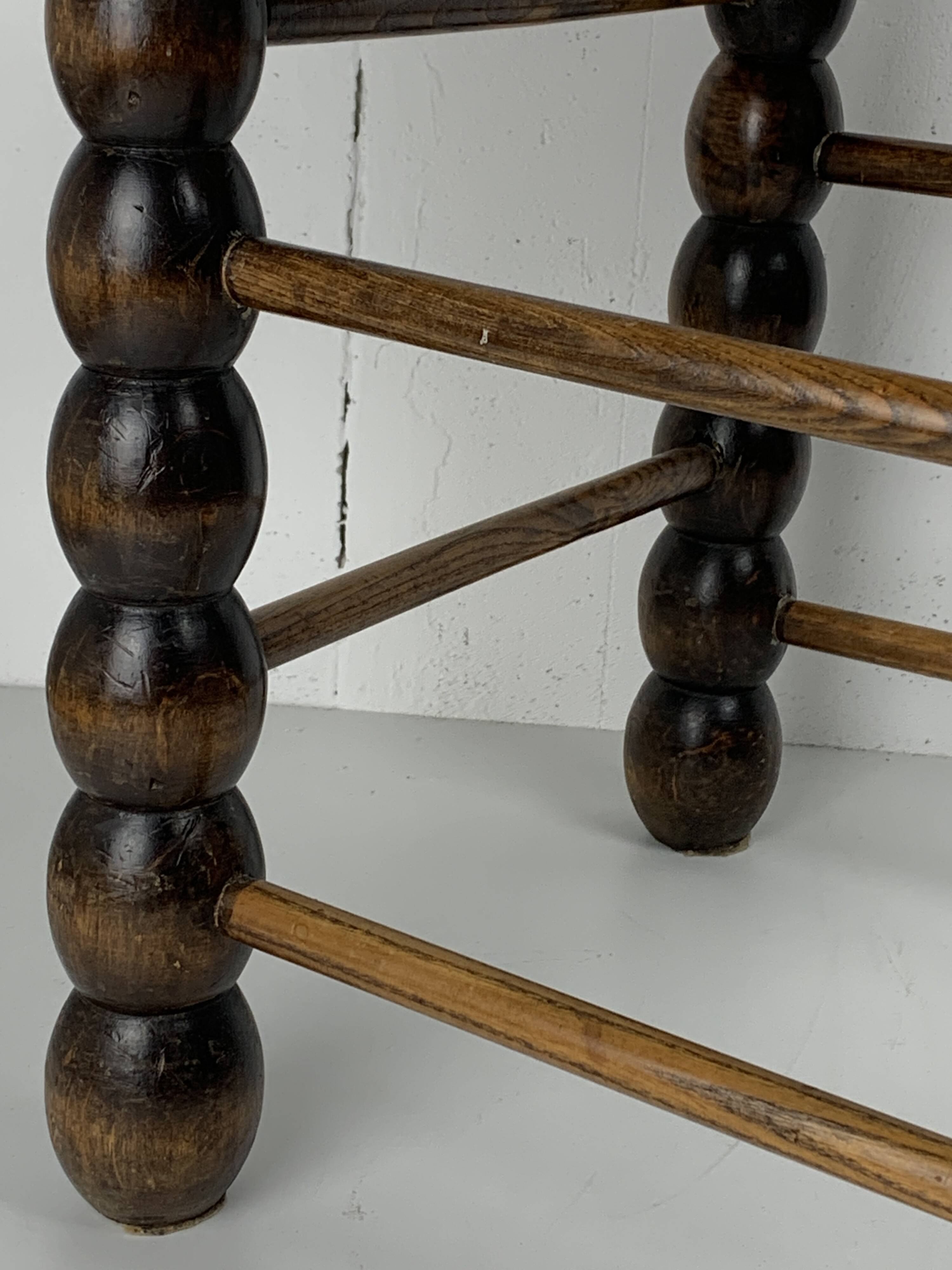 Brutalist wood turned bobbin rush stool in the style of Charles Dudouyt