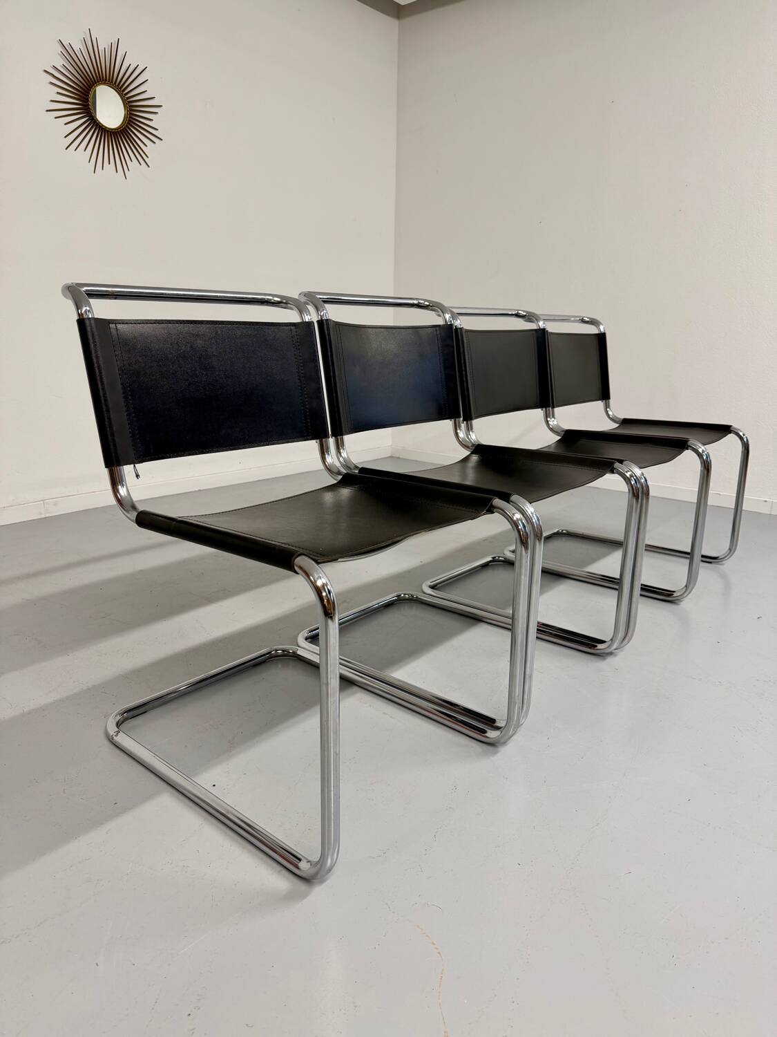 Lot of 4 tubular chairs designed by Mart Stam in vintage black leather from the 1980s.
