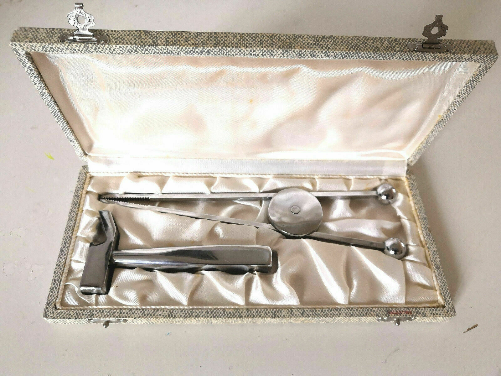 Ice pliers and ice hammer by Jacques Adnet