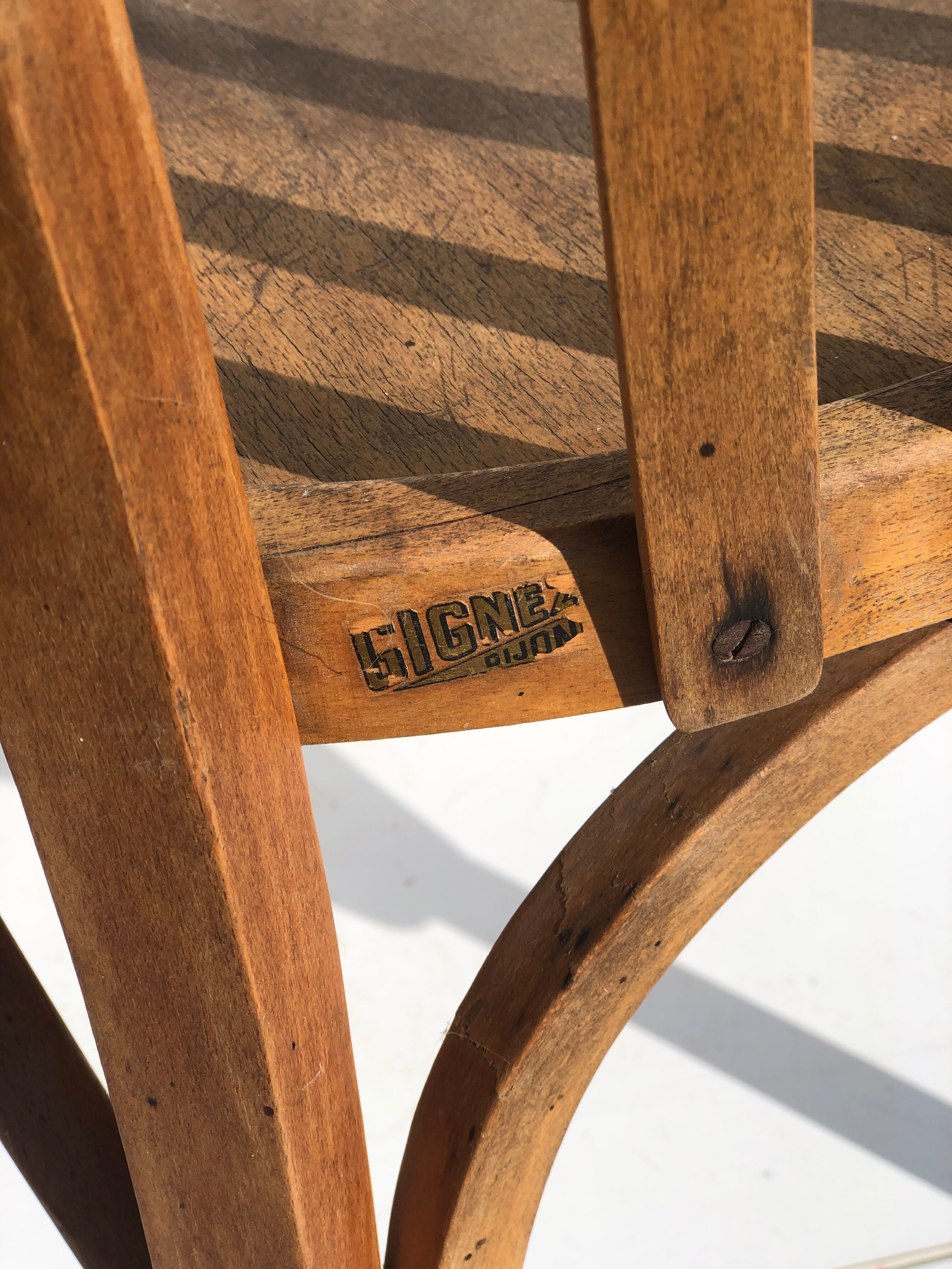 Curved wooden armchair