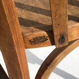 Curved wooden armchair