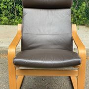 Scandinavian rocking chair in curved wood and brown leather from IKEA Poang