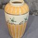 Orange and green ceramic vase with duck motif