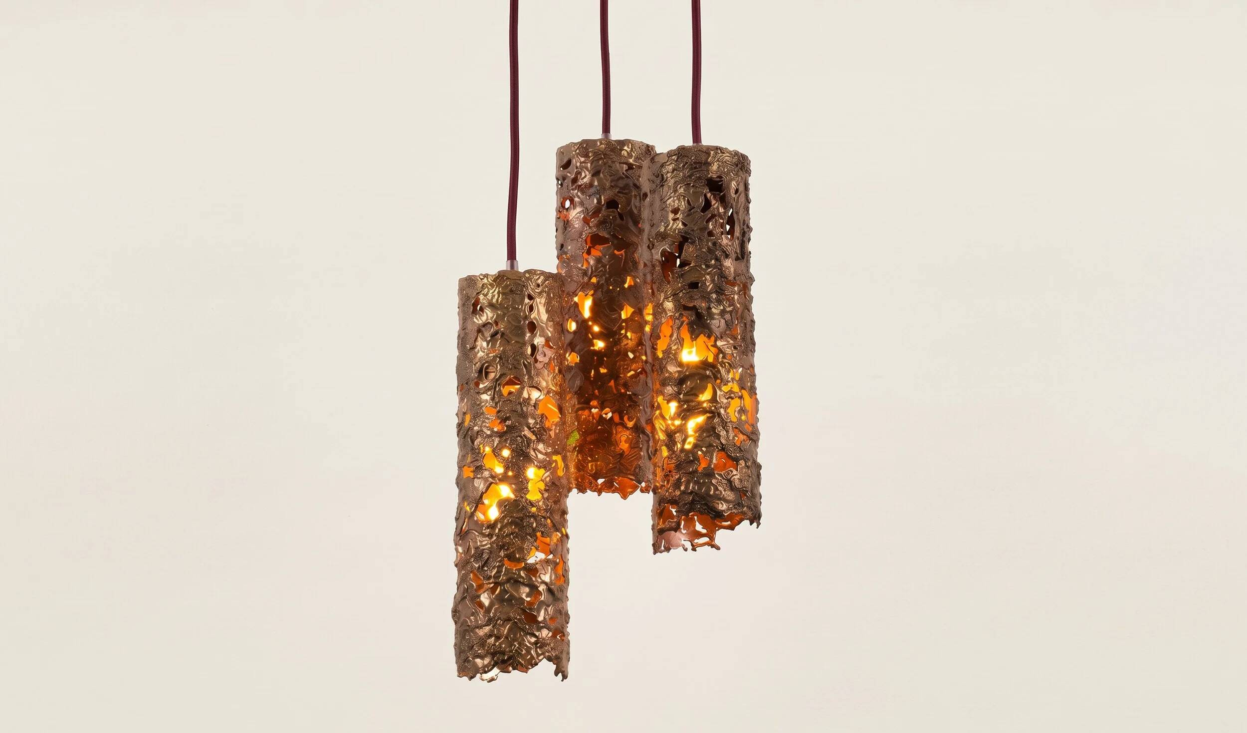 Suspension composed of 3 brutalist copper lamps by Aimo Tukiainen, 1960s.