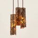 Suspension composed of 3 brutalist copper lamps by Aimo Tukiainen, 1960s.