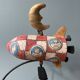 Old painted sheet metal pendulum toy