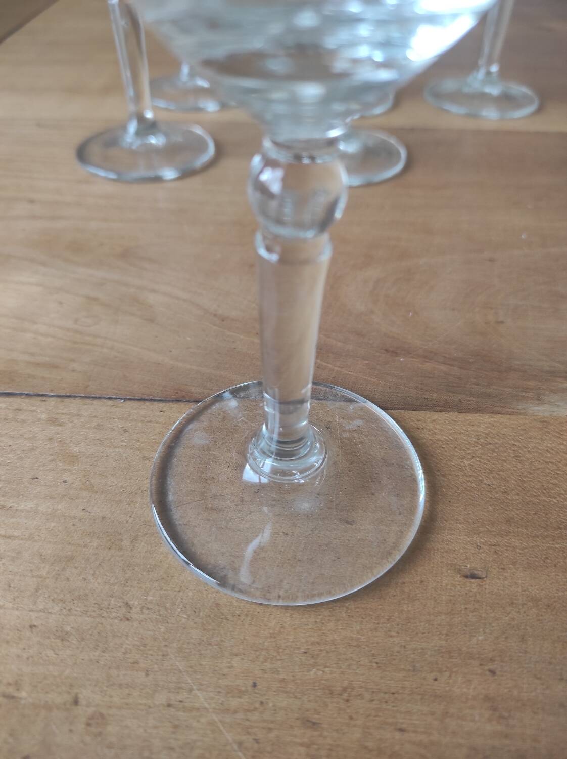 Set of 6 glasses with gold band decorations.