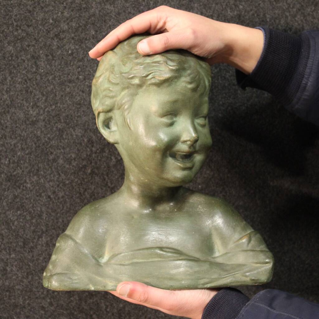 Sculpture in bronze painted terracotta bust of a child