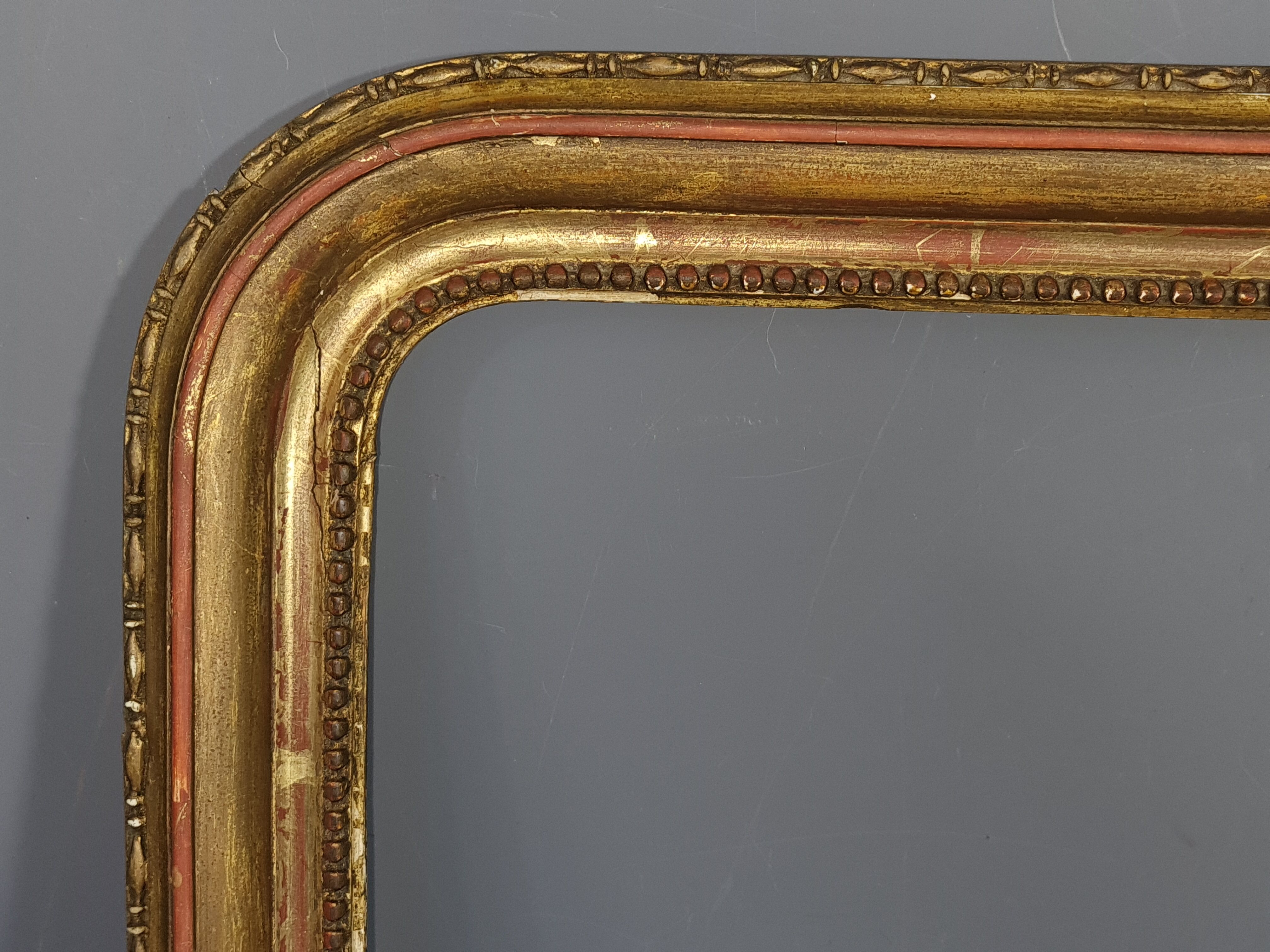 Old frame with doucine gilded stucco wood