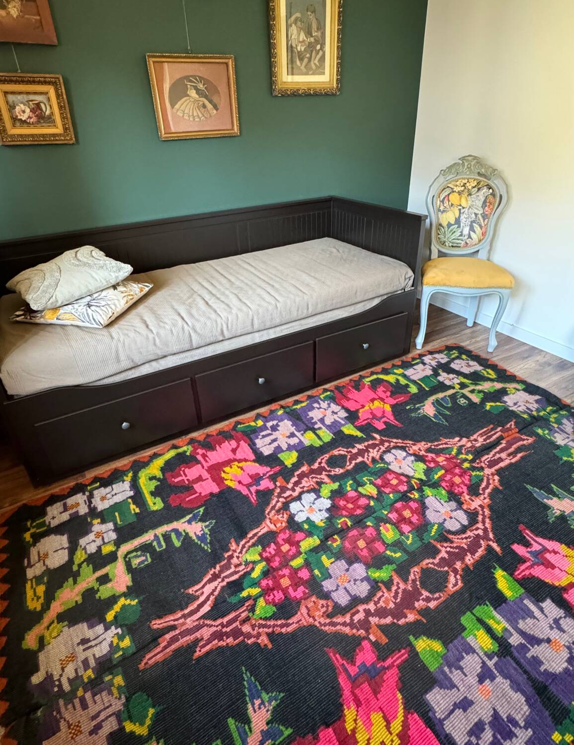 Bohemian floral design, handwoven wool rug, black background with colorful flowers