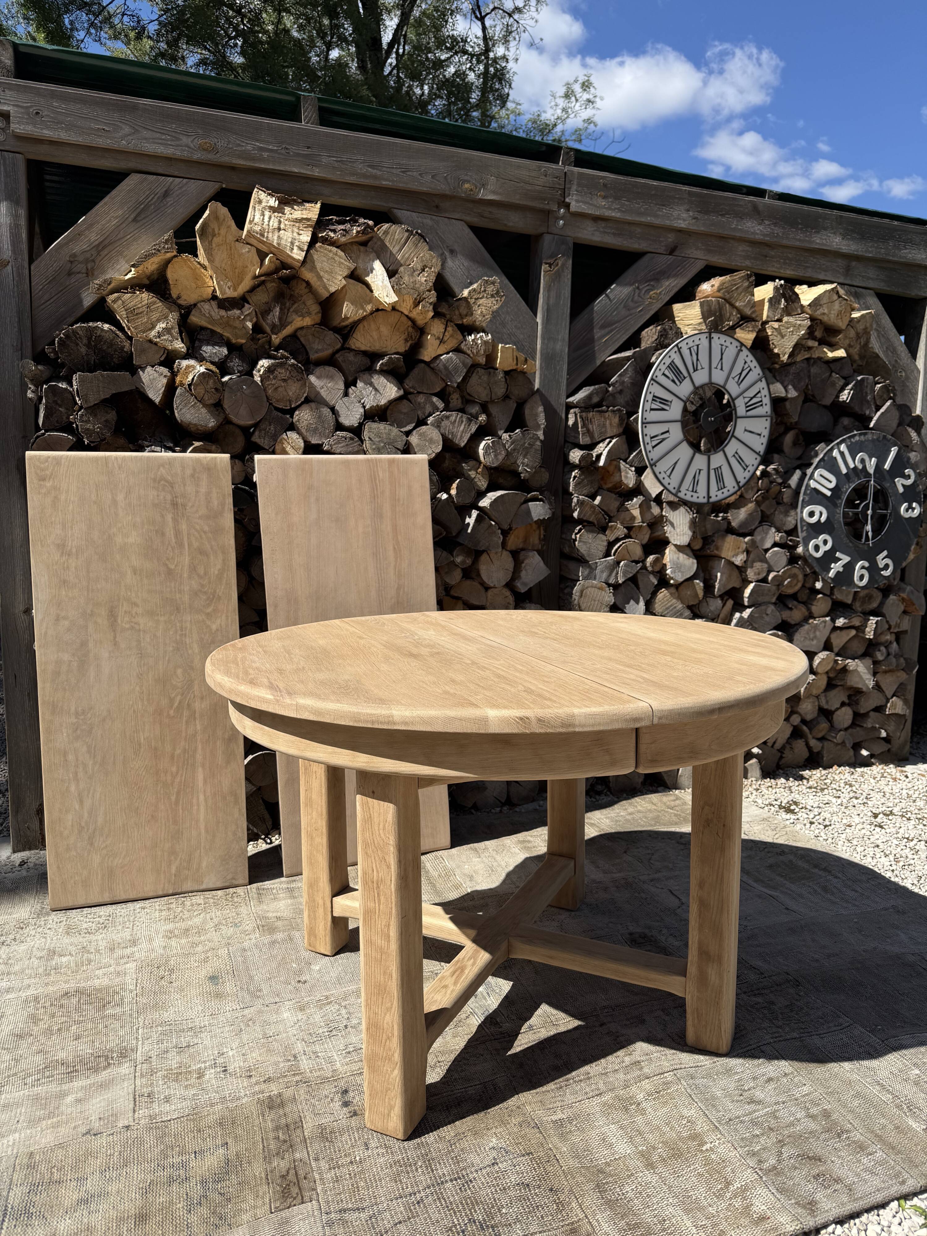 Round solid oak table with extensions, maximum 220cm.