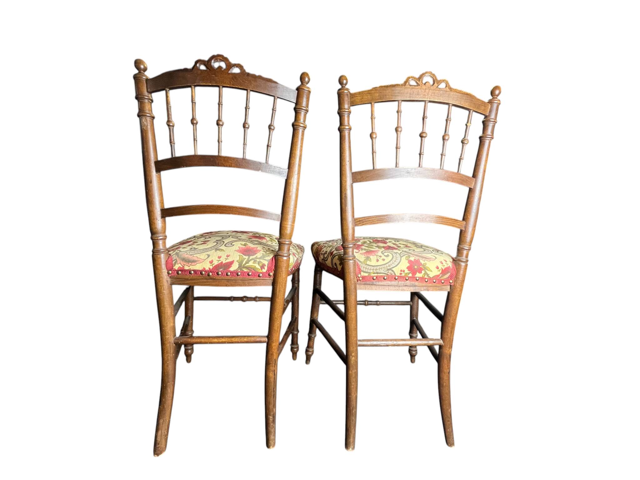 Two floral upholstered music chairs from the early 20th century.