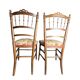 Two floral upholstered music chairs from the early 20th century.