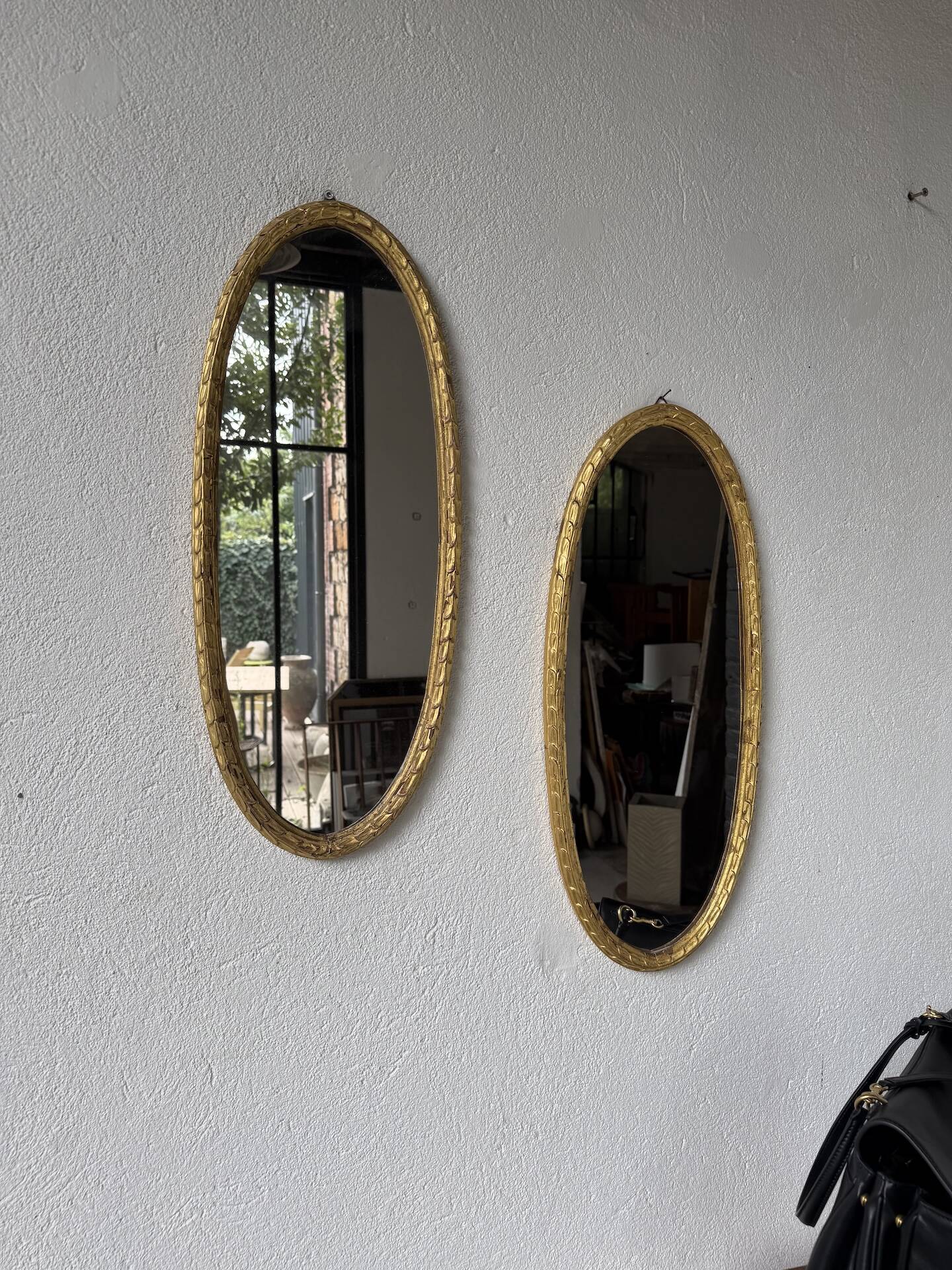 Pair of oval mirrors 1900 gilded stucco