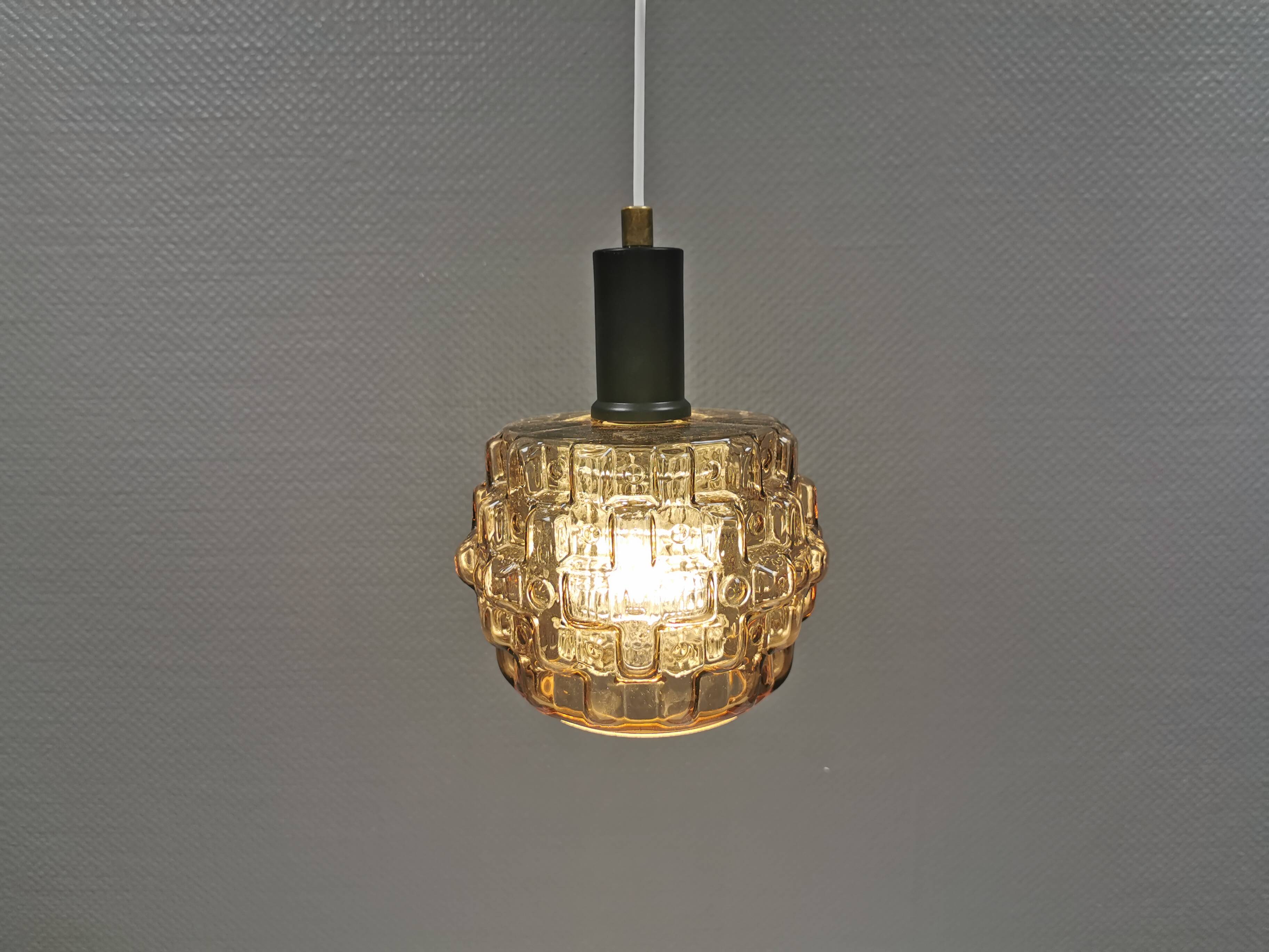 Older hanging lamp with champagne colored outer glass with inner shade of crystal glass.