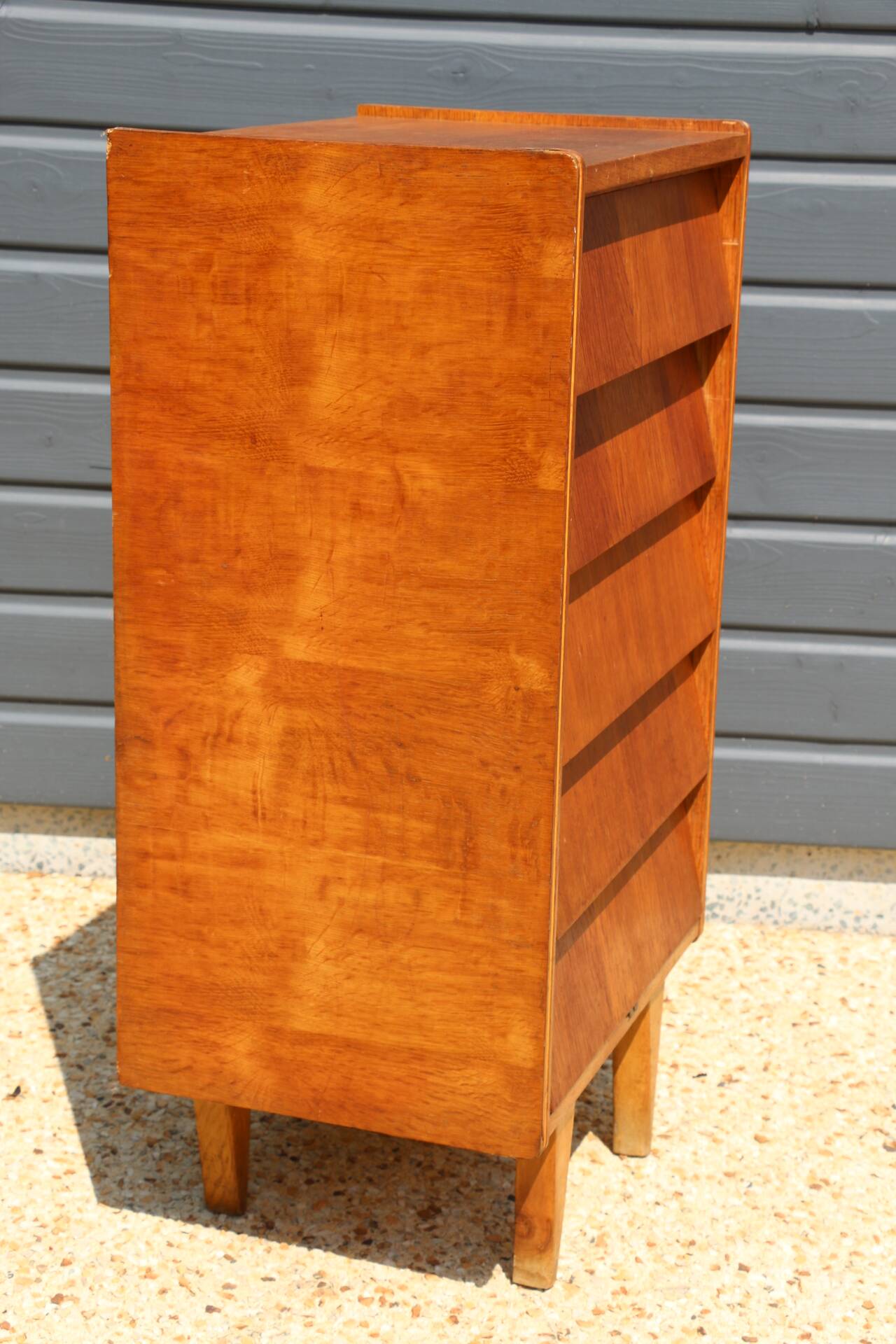 Dark chest of drawers with 5 drawers from the 1950s
